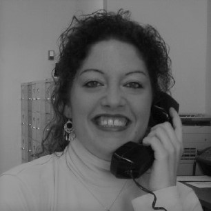 a woman standing in front of a mirror posing for the camera